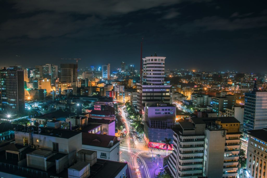 Nairobi Lifestyle Circuit - Vibrant Nightlife & Entertainment Upbeat nightclub scene in Nairobi with vibrant lighting and people dancing.